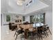 Living room with a stone fireplace and oversized glass doors at 10122 Royal Island Ct, Orlando, FL 32836