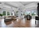 Spacious living room featuring lots of natural light and hardwood floors at 10122 Royal Island Ct, Orlando, FL 32836
