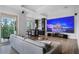Living room with an entertainment system and wet bar at 10122 Royal Island Ct, Orlando, FL 32836