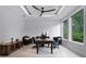 Bright office space with abundant natural light, featuring a modern ceiling fan and comfortable seating at 10122 Royal Island Ct, Orlando, FL 32836