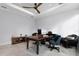 Well-appointed office with neutral tones, featuring a vintage-style desk, elegant decor, and comfortable seating options at 10122 Royal Island Ct, Orlando, FL 32836