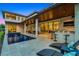 Expansive covered patio with an outdoor kitchen, bar, and lounge area for entertaining by the pool at 10122 Royal Island Ct, Orlando, FL 32836
