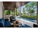 Lovely patio with a comfortable seating area and an outdoor bar overlooking the sparkling pool at 10122 Royal Island Ct, Orlando, FL 32836