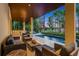 Spacious covered patio with outdoor furniture, a BBQ bar and stunning views of the waterfront at 10122 Royal Island Ct, Orlando, FL 32836