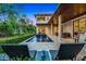Inviting backyard pool and covered patio with outdoor seating perfect for relaxing and entertaining at 10122 Royal Island Ct, Orlando, FL 32836