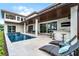 Backyard oasis features a plunge pool with fountain, outdoor bar, and expansive patio, creating an ideal space for entertaining and relaxation at 10122 Royal Island Ct, Orlando, FL 32836