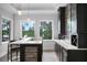 Custom wet bar with custom cabinetry, stone accents, and lake views at 10122 Royal Island Ct, Orlando, FL 32836