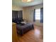 Relaxing bedroom with wood floors, natural light, and a cozy atmosphere at 1022 E 3Rd Ave, Mount Dora, FL 32757