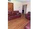 Inviting living room with hardwood floors, warm lighting, and comfortable leather seating at 1022 E 3Rd Ave, Mount Dora, FL 32757