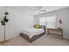 Cozy bedroom with natural light, featuring a single bed, desk, and minimalist decor at 11287 Stewart Loop, Oxford, FL 34484