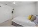 Bright bedroom with a comfortable bed, ceiling fan, and simple decorations, offering a serene space at 11287 Stewart Loop, Oxford, FL 34484