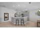 Spacious kitchen with breakfast bar, stainless appliances and open layout at 11287 Stewart Loop, Oxford, FL 34484