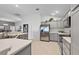 Bright kitchen featuring stainless steel appliances, and ample counter space at 11287 Stewart Loop, Oxford, FL 34484