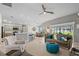 Open-concept living area connecting the kitchen, dining, and living spaces at 11287 Stewart Loop, Oxford, FL 34484
