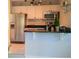 Modern kitchen with stainless steel appliances, white cabinets, and granite countertops with ample counter space at 1225 E 1St Ave, Mount Dora, FL 32757