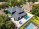Beautiful aerial view of the backyard featuring a pool, hot tub, patio area, and serene outdoor space at 12833 Hyland Ln, Clermont, FL 34711