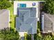 Aerial view of house showing roof, pool, hot tub, and back yard at 12833 Hyland Ln, Clermont, FL 34711
