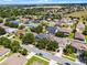 Lovely aerial view of a residential street highlighting the property's location, curb appeal, and neighborhood setting at 12833 Hyland Ln, Clermont, FL 34711