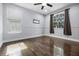 Bedroom with hardwood floors and lots of natural light at 12833 Hyland Ln, Clermont, FL 34711