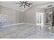 Large bedroom featuring marble flooring and an ensuite bathroom at 12833 Hyland Ln, Clermont, FL 34711