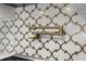 Detailed view of the kitchen backsplash and pot filler at 12833 Hyland Ln, Clermont, FL 34711