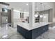 Modern kitchen with a large island, stainless steel appliances, and stylish pendant lighting at 12833 Hyland Ln, Clermont, FL 34711