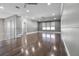 Upstairs living room with hardwood floors and windows at 12833 Hyland Ln, Clermont, FL 34711