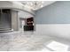 Stylish open-concept area with stairs, modern lighting, and sleek marble floors at 12833 Hyland Ln, Clermont, FL 34711