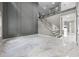 Spacious living room with stairs and sleek finishes at 12833 Hyland Ln, Clermont, FL 34711