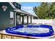 Beautiful outdoor pool and hot tub next to covered patio with white pillars perfect for relaxing at 12833 Hyland Ln, Clermont, FL 34711
