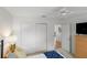 Bedroom with closet, ceiling fan, and doorway to an adjacent room at 1291 Jonesville Ter, The Villages, FL 32162