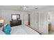 Spacious main bedroom with white walls, carpet, dresser, and ceiling fan at 1291 Jonesville Ter, The Villages, FL 32162