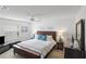 Serene main bedroom with white walls, carpet, dresser, and coordinated furnishings at 1291 Jonesville Ter, The Villages, FL 32162