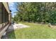 A well-kept yard featuring verdant grass and a privacy fence, creating a serene outdoor space at 1303 E Schwartz Blvd, Lady Lake, FL 32159
