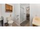 Bathroom featuring a shower and a vanity with storage cabinet in neutral color palette at 1303 E Schwartz Blvd, Lady Lake, FL 32159