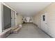 Covered front porch with ample space, featuring multiple doors and windows for natural light at 1303 E Schwartz Blvd, Lady Lake, FL 32159