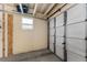 A clean and functional garage space with a white overhead door at 1303 E Schwartz Blvd, Lady Lake, FL 32159