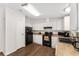 Efficient kitchen featuring black appliances and white cabinets at 1303 E Schwartz Blvd, Lady Lake, FL 32159