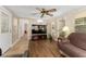 Bright living room with wood laminate flooring and a television at 1303 E Schwartz Blvd, Lady Lake, FL 32159