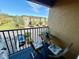 Cozy balcony view of neighborhood homes showcasing a table and chairs for outdoor enjoyment at 147 Aston Grande Dr, Daytona Beach, FL 32124