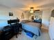 Bedroom with a ceiling fan, neutral carpet, a dedicated workspace, and closet at 147 Aston Grande Dr, Daytona Beach, FL 32124