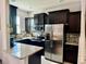 Modern kitchen featuring granite countertops, stainless steel appliances, and sleek cabinetry at 147 Aston Grande Dr, Daytona Beach, FL 32124