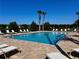 Community swimming pool with comfortable lounge chairs perfect for soaking up the sun at 147 Aston Grande Dr, Daytona Beach, FL 32124