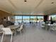 Relaxing poolside seating area with tables and chairs, perfect for enjoying the community swimming pool at 147 Aston Grande Dr, Daytona Beach, FL 32124