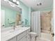 Bathroom with vanity, mirror, and shower/tub combo with modern fixtures at 1521 Southport St, The Villages, FL 32162