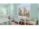 Comfortable bedroom area with desk by the window and plantation shutters at 1521 Southport St, The Villages, FL 32162