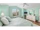 Spacious bedroom with vaulted ceiling, ceiling fan, large window, and wood floors at 1521 Southport St, The Villages, FL 32162
