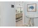 View into a bedroom with light blue walls, a ceiling fan, and a stylish bed at 1521 Southport St, The Villages, FL 32162