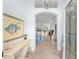 Welcoming foyer with tiled floors, an arched entrance, and a view of the light-filled living spaces at 1521 Southport St, The Villages, FL 32162