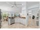 Kitchen offering stainless steel appliances, granite countertops, and open floorplan at 1521 Southport St, The Villages, FL 32162
